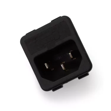The Ambiente Power Plug Socket/Connector - Ventus is a black, rectangular electrical connector with three metal prongs inside, shown angled against a white background—commonly used in espresso machines and grinders. © 2025 1st-line.com