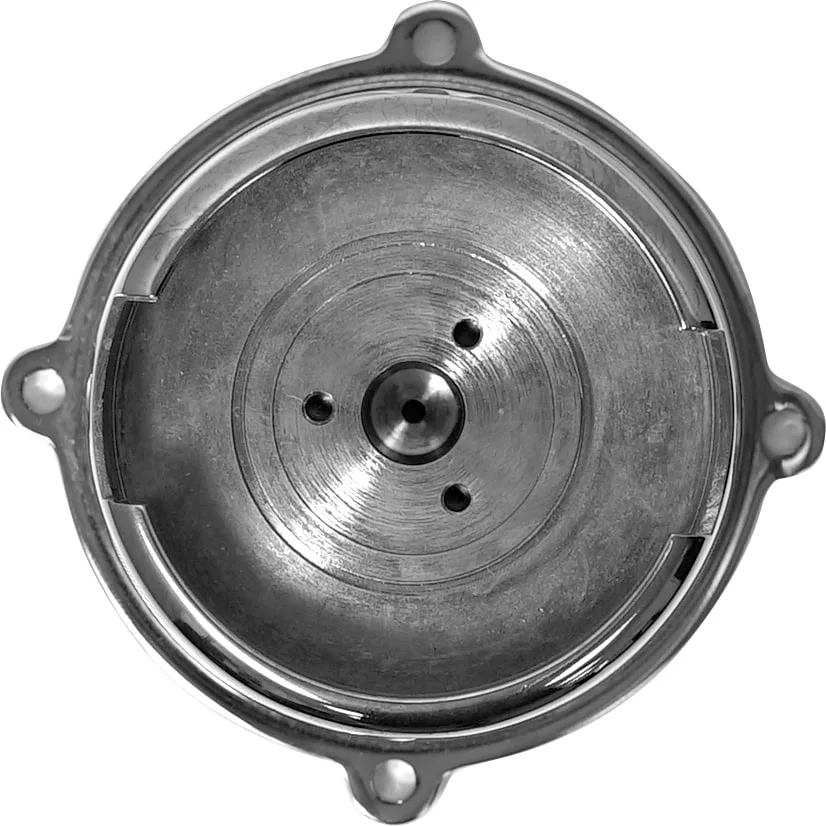 The Ascaso Group Bell - 57 mm, brass is a round, metallic part with a central raised section, three holes in a triangular arrangement, and four mounting tabs with holes. Its smooth, reflective surface suits versatile models. © 2025 1st-line.com