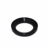The Caffemotive FMADA0001X00 Plastic Adaptor for Filter for Bacchi Espresso Machine is a black, circular accessory with a wide outer edge and hollow center, shown on a white background. © 2025 1st-line.com