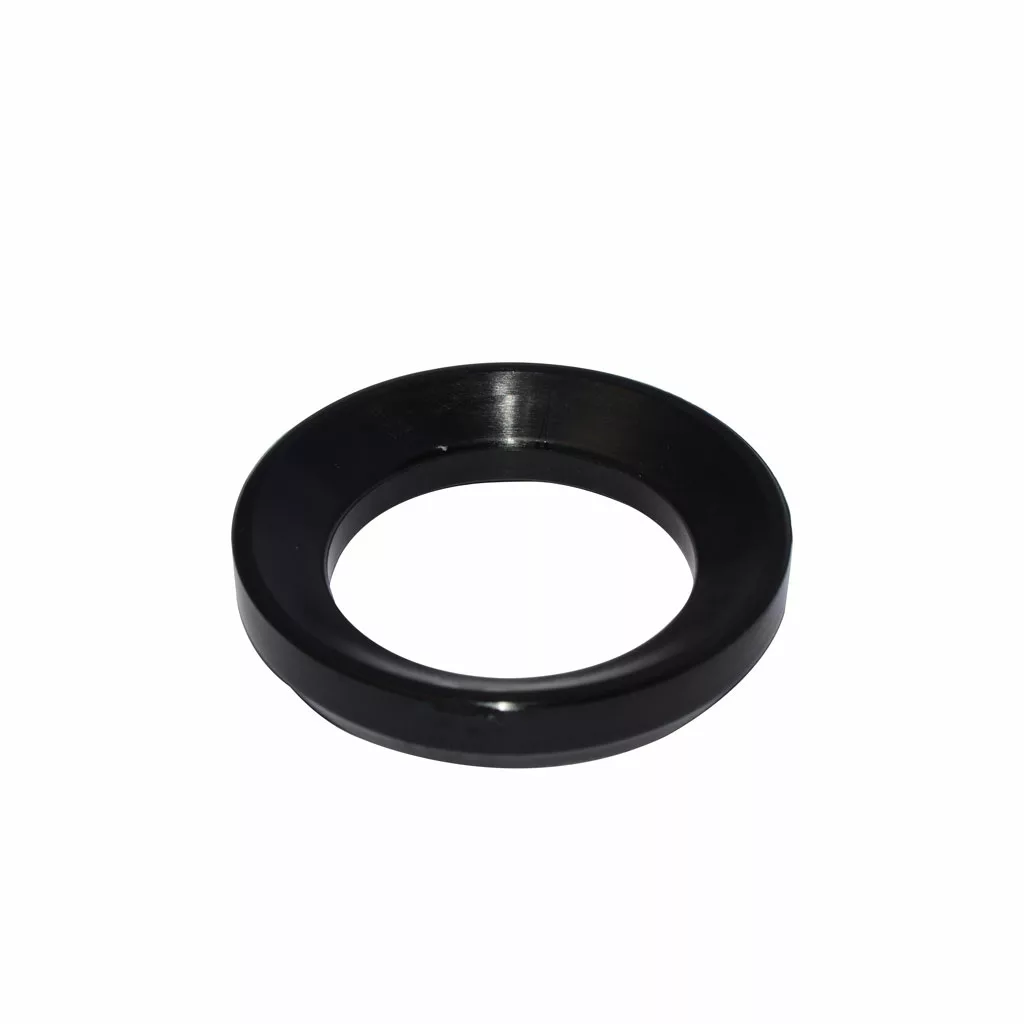 The Caffemotive FMADA0001X00 Plastic Adaptor for Filter for Bacchi Espresso Machine is a black, circular accessory with a wide outer edge and hollow center, shown on a white background. © 2025 1st-line.com