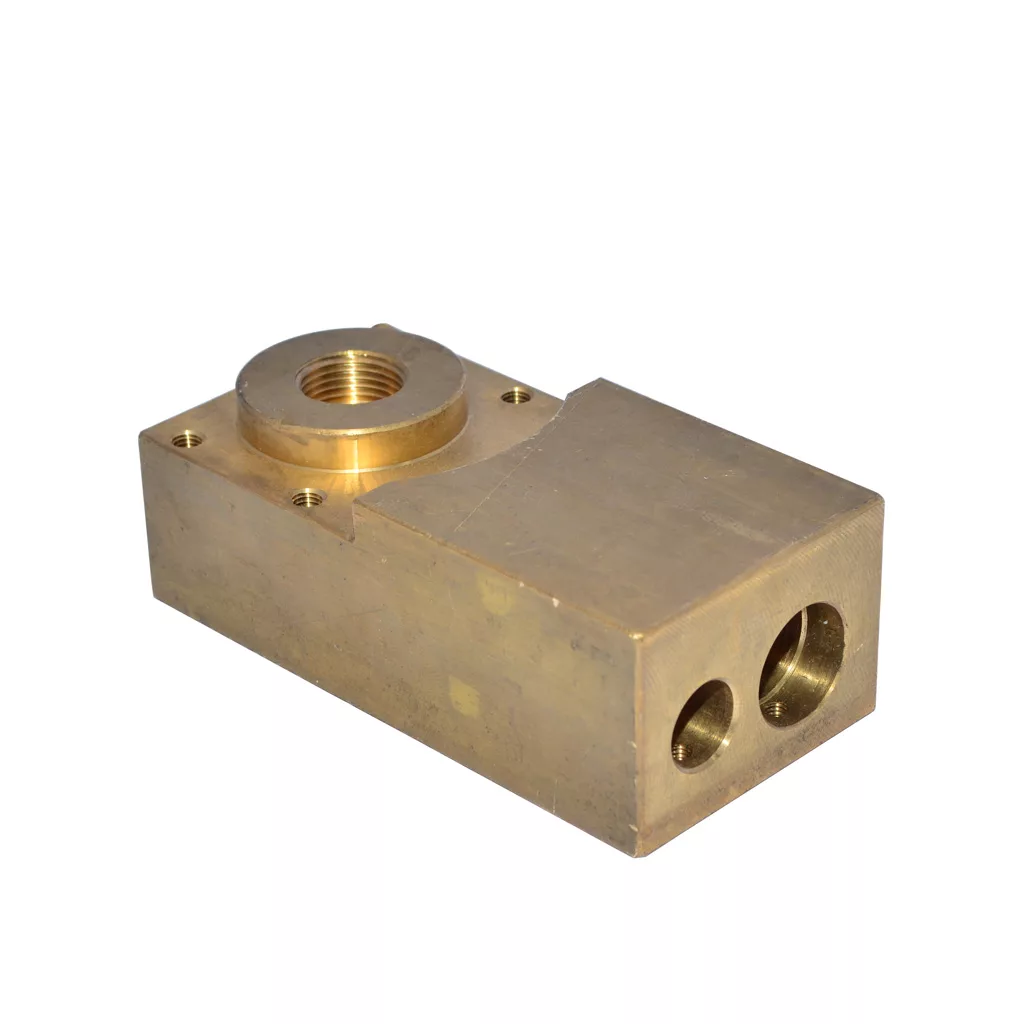 The Didiesse Heating Block is a rectangular brass block with a threaded circular opening on top and two round holes at one end, shown against a plain white background. © 2025 1st-line.com