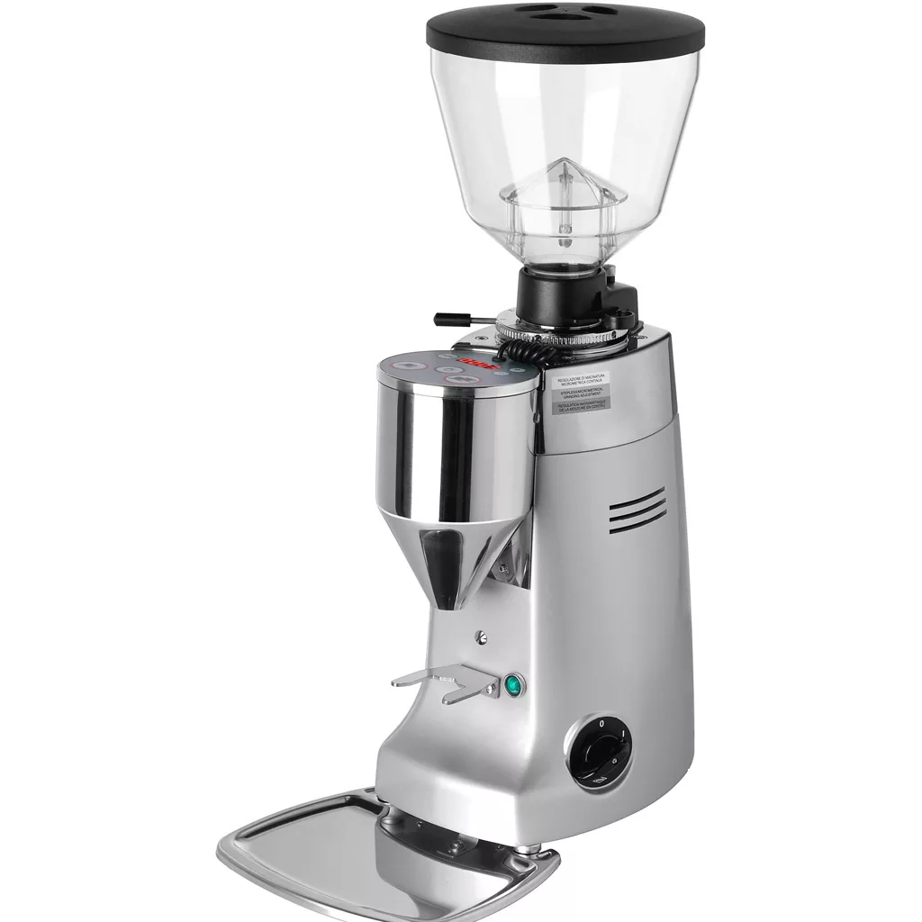 The DISCONTINUED Mazzer Kony Electronic Stepless Doserless Espresso Coffee Grinder has a clear bean hopper, metal chute for dispensing coffee, control buttons, and a bottom tray for catching excess grounds. © 2025 1st-line.com