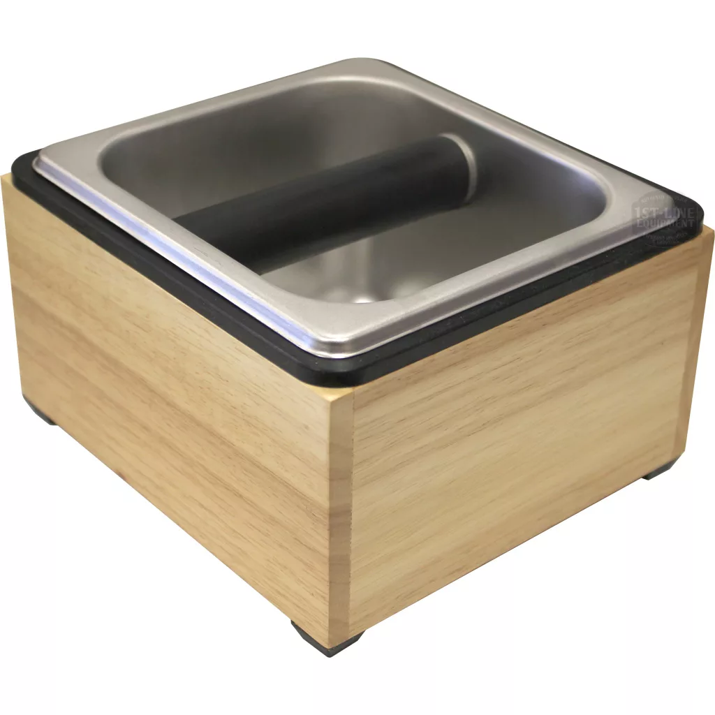 The DISCONTINUED Revolution 25670 Basic Knock Box Set (7.5 x 7 x 4.5) includes a wooden base, stainless steel top, and black rubber bar for easy coffee ground disposal. © 2025 1st-line.com