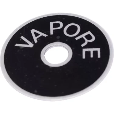 The ECM B5522055 Steam Knob Washer is a round black washer with a central hole and partially visible white VAPORE text, designed for use with ECM machines. © 2025 1st-line.com