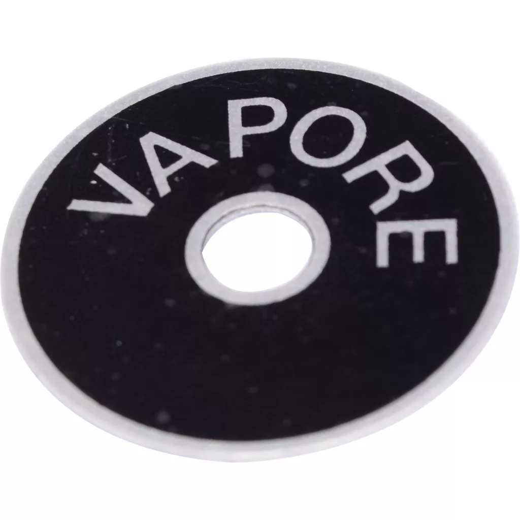 The ECM B5522055 Steam Knob Washer is a round black washer with a central hole and partially visible white VAPORE text, designed for use with ECM machines. © 2025 1st-line.com