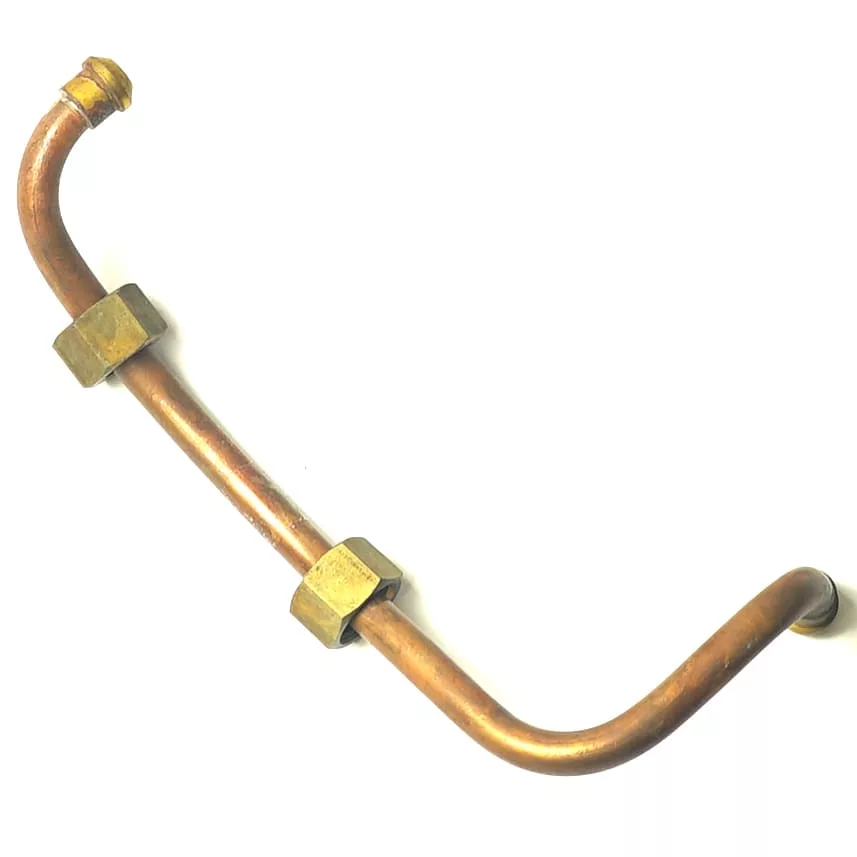 The Elektra 00767011 Bottom of Boiler -> Group Pipe is a bent copper pipe with two large brass hex nuts and fittings, featuring threaded ends and a curved design, compatible with Elektra boilers. Photographed on a white background. © 2025 1st-line.com