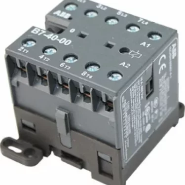 The Elektra 03244035 Electromagnetic Switch for Sixties 2 Group is a black industrial unit with multiple labeled screw terminals, technical markings on the side, and mounting features. © 2025 1st-line.com
