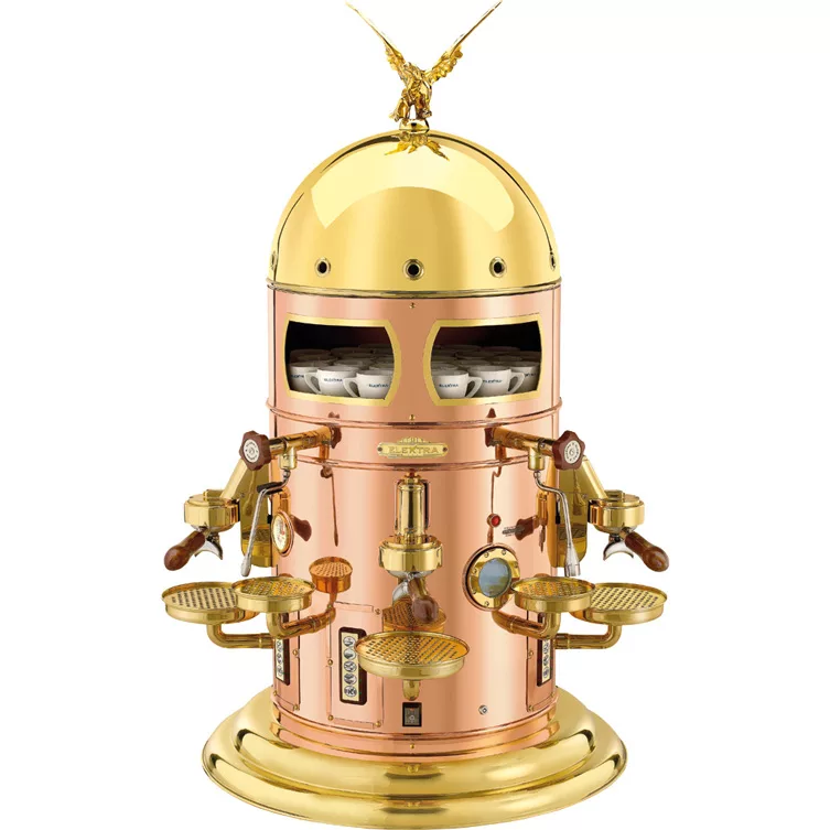 The Elektra Belle Epoque 3 Group Commercial Espresso Machine boasts a striking dome-topped design with gold and copper finishes, wooden handles, gauges, cup trays, multiple spouts, and a decorative eagle for classic vintage flair. © 2025 1st-line.com