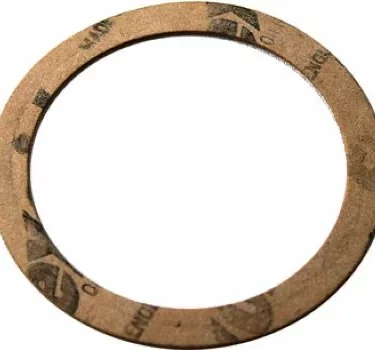 The Fiorenzato A1200033 Paper Gasket Thickness for Basket is a thin, circular brown gasket with a large center hole and thickness markings on the outer ring. © 2025 1st-line.com