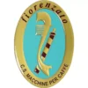 The Fiorenzato A2400044A Logo Emblem showcases an oval gold and turquoise design with Fiorenzato on top, C.S. Macchine per Caffè below, a striped coffee machine part in the center, and marked A2400044A. © 2025 1st-line.com
