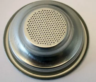 The Grimac 1-Cup Filter Basket/Cup with Rim 7g for Zola & MiniGrimac is a metal espresso machine filter basket designed to hold ground coffee. © 2025 1st-line.com