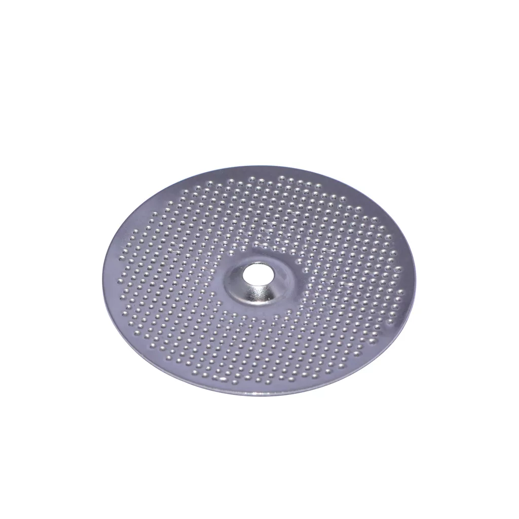 The Isomac Maverick Shower/Dispersion Screen is a round, flat metal disc with a grid of small holes and a central hole, used as a filter plate for espresso machines. Shown against a plain white background. © 2025 1st-line.com