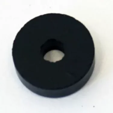 The La Cimbali C003 Steam/Water Valve Gasket is a black, round, flat disc with a center hole—resembling a washer—shown on a white background and ideal for steam valve applications. © 2025 1st-line.com