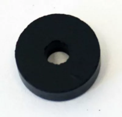 The La Cimbali C003 Steam/Water Valve Gasket is a black, round, flat disc with a center hole—resembling a washer—shown on a white background and ideal for steam valve applications. © 2025 1st-line.com