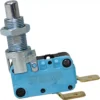The La Nuova Era NE457 Tank/Reservoir Microswitch is blue, with a spring plunger actuator, metal mounting hardware, two brass terminals, and part numbers printed on the casing. © 2025 1st-line.com