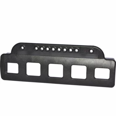 The La Spaziale Viv7403 Circuit Command Panel Face Cover - S1 is a black rectangular metal bracket with four square cutouts at the bottom and eight circular holes along the top edge. © 2025 1st-line.com