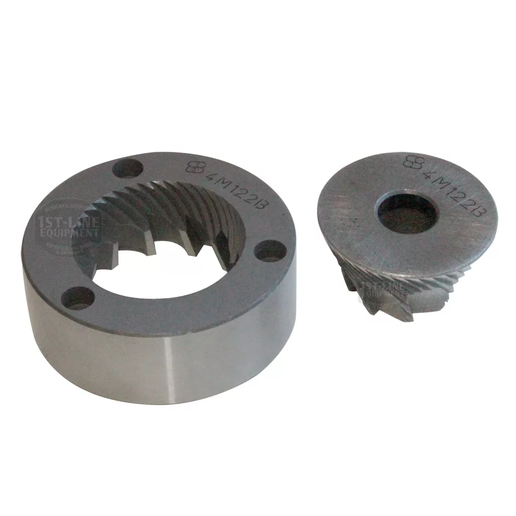 The Macap C0004M122B 63mm Conical Grinding Burrs set includes a ring-shaped and a cone-shaped burr with angled cutting ridges and engraved markings, shown on a white background. © 2025 1st-line.com