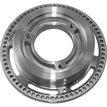 The Macap C242004 Upper Burr Holder - M2 is a circular metal part with a central hole, inner grooves, and evenly spaced holes around the edge, serving as an upper burr holder for coffee grinders. © 2025 1st-line.com