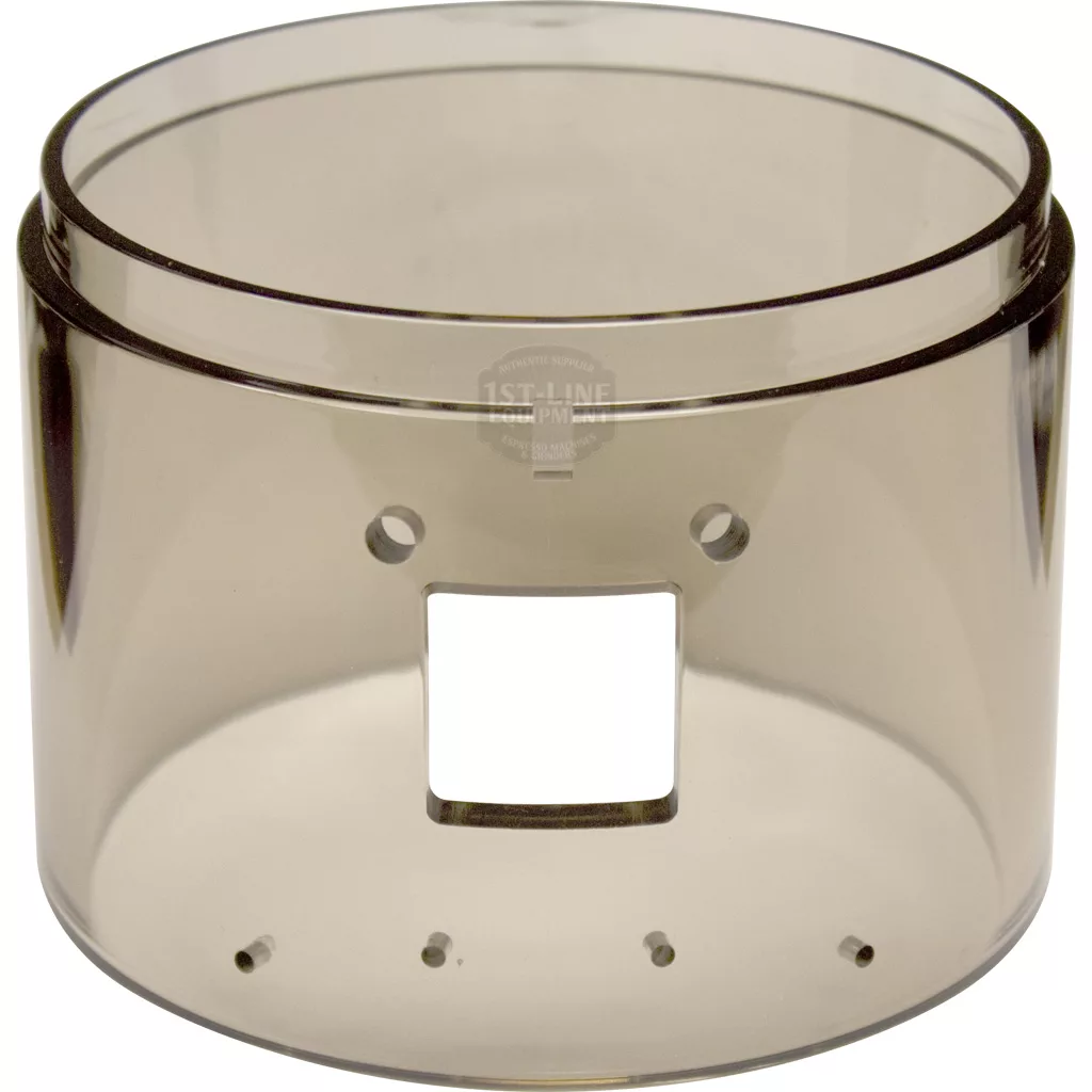 The Macap Doser Cylinder - C0007M159 is a clear, cylindrical plastic container with a square cut-out and several small round holes on one side. Its transparent material shows the smooth, empty interior. © 2025 1st-line.com