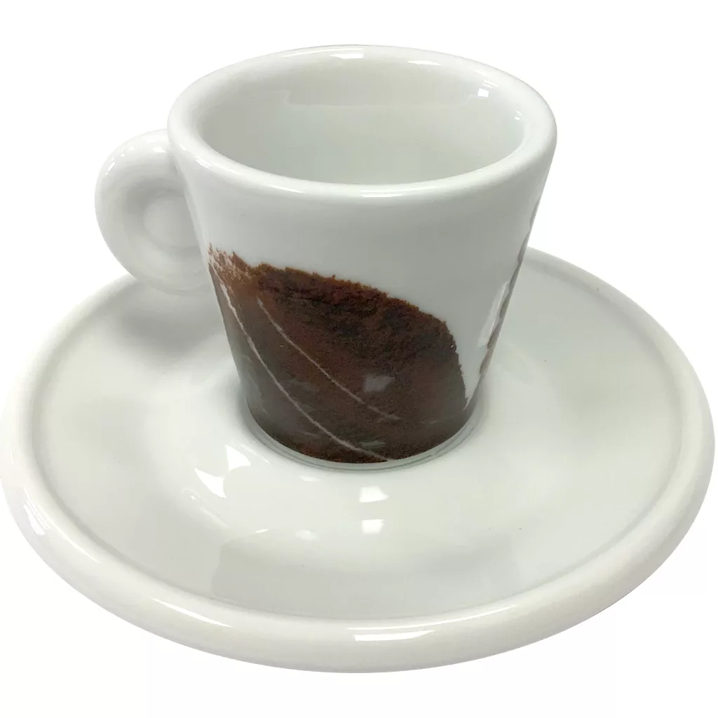 The Miscela dOro Espresso Cup & Saucer - 2 fl oz is a white ceramic cup with a handle and matching saucer, featuring a brown coffee stain design along the side of the cup. © 2025 1st-line.com