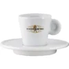 The Miscela dOro Espresso Cup & Saucer - 2 fl oz is a white porcelain cup with a handle, displaying the gold and black Miscela dOro logo on the front, paired with a matching saucer. © 2025 1st-line.com