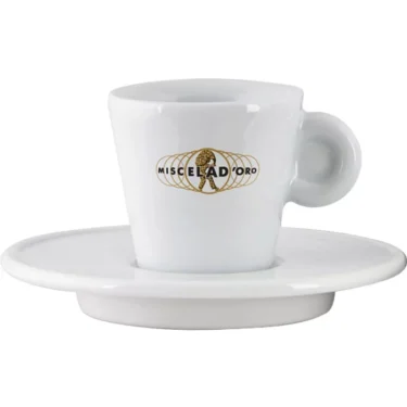 The Miscela dOro Espresso Cup & Saucer - 2 fl oz is a white porcelain cup with a handle, displaying the gold and black Miscela dOro logo on the front, paired with a matching saucer. © 2025 1st-line.com