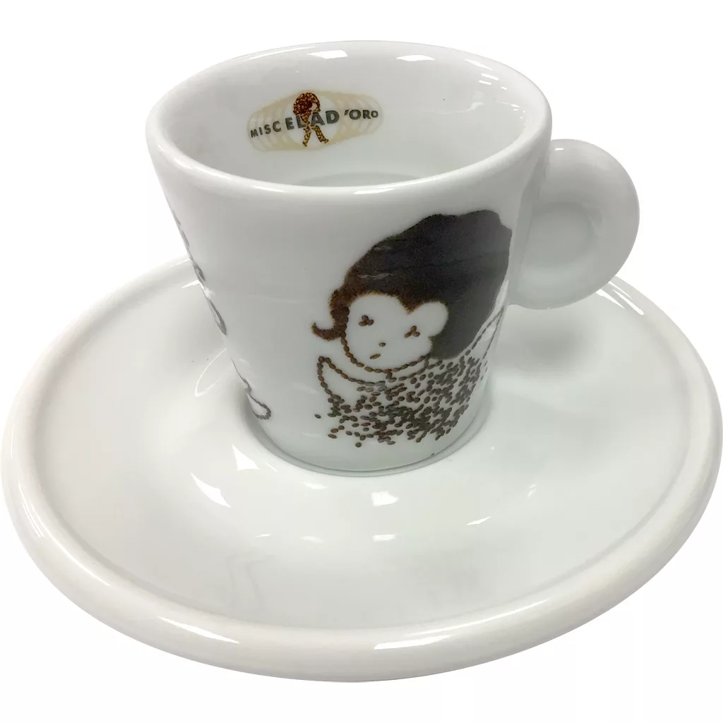 The Miscela dOro Espresso Cup & Saucer (2 fl oz) is a white set with a brown hedgehog illustration on the cup and a Miscela dOro logo with text and graphic inside the rim. © 2025 1st-line.com