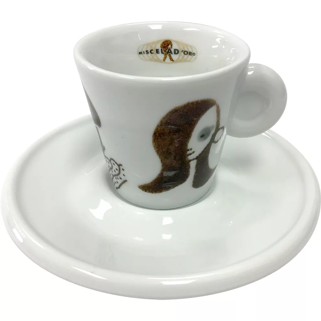 The Miscela dOro Espresso Cup & Saucer (2 fl oz) is a white set with abstract face artwork and Miscela d’Oro printed inside the rim of the cup. © 2025 1st-line.com