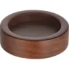 The Motta 668 Flat Wooden Tamper Holder is round and shallow with smooth edges and a natural brown finish, displayed on a white background. © 2025 1st-line.com