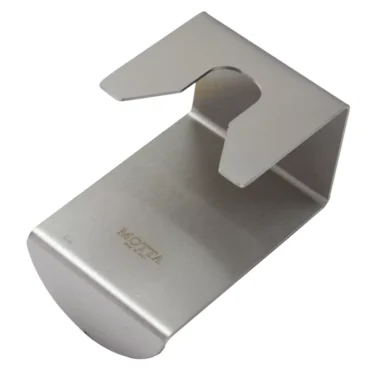 The Motta 8210 Stainless Steel Angled Tamping Stand features a slotted top, brushed finish, and an engraved Motta base, combining functionality with elegance. © 2025 1st-line.com