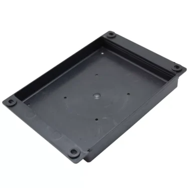 The Pasquini Cover - Bottom - Plastic - Tav2.15 For Livia 90 is a rectangular black enclosure with four corner screw holes and a flat base, ideal as a replacement cover for Livia 90 or Tav2.15 espresso machines. © 2025 1st-line.com