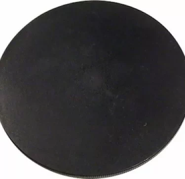 The Rancilio 38123033 Bean Hopper Cover - Rocky, a flat, circular black item with a smooth surface, is pictured against a plain white background. © 2025 1st-line.com