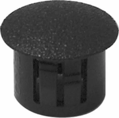 The Rancilio 38221007 Doser Tank/Reservoir Cap is a black plastic hole plug with a textured, rounded top and slotted sides for secure panel or surface installation. © 2025 1st-line.com