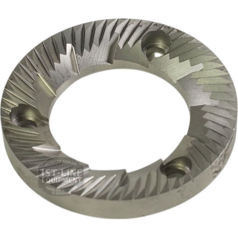 The Rancilio 69000306 64mm Single Flat Grinding Burr features a circular metal build with sharp angled teeth and three evenly spaced screw holes, designed for use with Rancilio machines. © 2025 1st-line.com