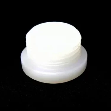 The Rocket A439904312 Water Tank/Reservoir Plug, a small white round plastic plug with ridged sides, is displayed on a black background. © 2025 1st-line.com