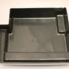 The Saeco Drip Tray Base for Royal Digital/Professional and Magic Deluxe is a black plastic, rectangular tray with raised edges and multiple compartments, including a left-side extension, shown on a plain white background. © 2025 1st-line.com