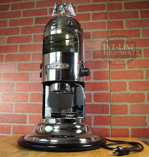 The SIDEWALK SALE - Elektra Mini Verticale A1C Espresso Machine - Chrome (E211) features a gleaming chrome finish and an eagle ornament, making it perfect for your home or next sidewalk sale. © 2025 1st-line.com