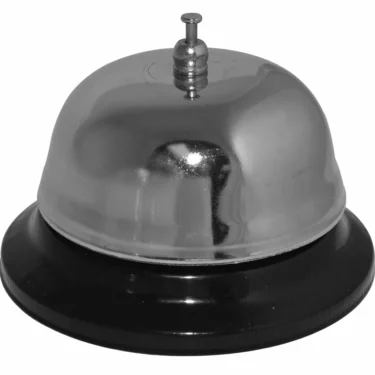 The TableDesk Bell, 4 Base - chrome plated, features a shiny chrome finish and black base, ideal for drawing attention at reception desks or counters. © 2025 1st-line.com