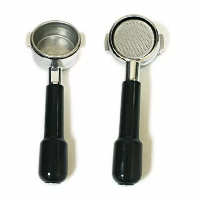 Two metal espresso portafilters with black handles are side by side; one shows the basket for grounds, while the other is a CLEARANCE! La Marzocco 50894 Bottomless/Naked Portafilter - 58mm, revealing its mesh filter bottom. © 2025 1st-line.com