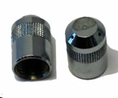 Two metallic knurled nuts from the Rancilio 23119023 Steam Wand Tip - 3 hole for Rancilio commercial models are shown, one upright and one on its side, both with textured surfaces for improved grip against a white background. © 2025 1st-line.com