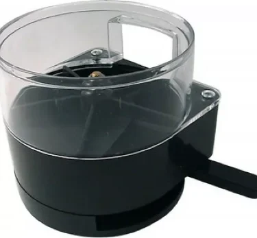 A black and transparent manual rotary cheese grater with a handle is shown against a white background, offering functionality similar to the Ascaso MI..30 Doser Assembly - I-1D, I-2D. © 2025 1st-line.com