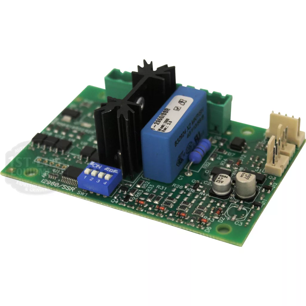 A close-up of the Ascaso I.2960 Multifunction Circuit displays a green PCB with components including a blue relay, black heat sinks, connectors, capacitors, and integrated circuits. © 2025 1st-line.com