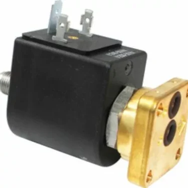 A close-up of the Fiorenzato A1900003 3-Way Solenoid Valve 220/240 50/60 shows a black rectangular coil housing, metal electrical terminals on top, and a brass mounting plate with two side holes. © 2025 1st-line.com