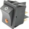 A close-up of the Fiorenzato A2100093A 250V ONLY Switch, black with a white O symbol and orange indicator light, featuring rear metal terminals for electrical connections. © 2025 1st-line.com