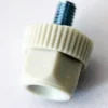 A close-up of the Lelit MC330 Screw Cap/Bolt for Chute shows a white plastic knob with a ridged edge, hexagonal base, and a metal threaded screw protruding from the top, placed on a light surface. © 2025 1st-line.com