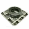 A metal ball bearing rests on a white square paper printed with Mazzer’s name and logo, mirroring the precision of Mazzer OEM FMA00033M/QQQ 1-Phase 64mm Flat Grinding Burrs (set of 2) and their quality components. © 2025 1st-line.com