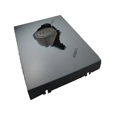 A metal sheet labeled LASER with a rough central hole reveals the ECM P3010E Back Body Panel with Emblem beneath, set against a white background. © 2025 1st-line.com