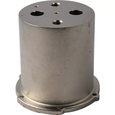 A professional cylindrical metal component, the Ascaso I.1214 Nickel Boiler for Professional, features a flat top with four holes and a flanged base with extra holes for mounting or connecting to other mechanical parts. © 2025 1st-line.com