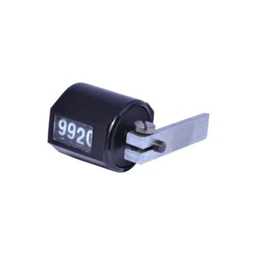 A Quamar 210033 Doser Counter in black, featuring a manual metal lever and digital display reading 9920, shown on a white background. © 2025 1st-line.com