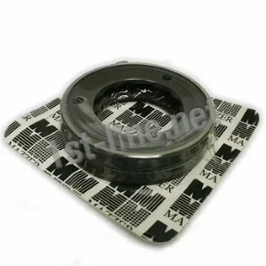 A round metal car part sits in clear plastic packaging with a white and black background featuring MA logos, resembling the packaging of Mazzer OEM FMA00151B 1-Phase 83mm Flat Grinding Burrs (set of 2) for Mazzer machines. © 2025 1st-line.com